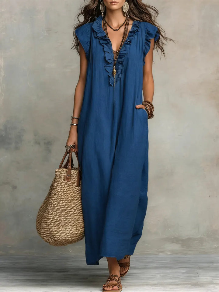 Comfortable women's V-neck maxi dress with ruffles, flutter sleeves, and practical pockets. Elegant summer fashion.