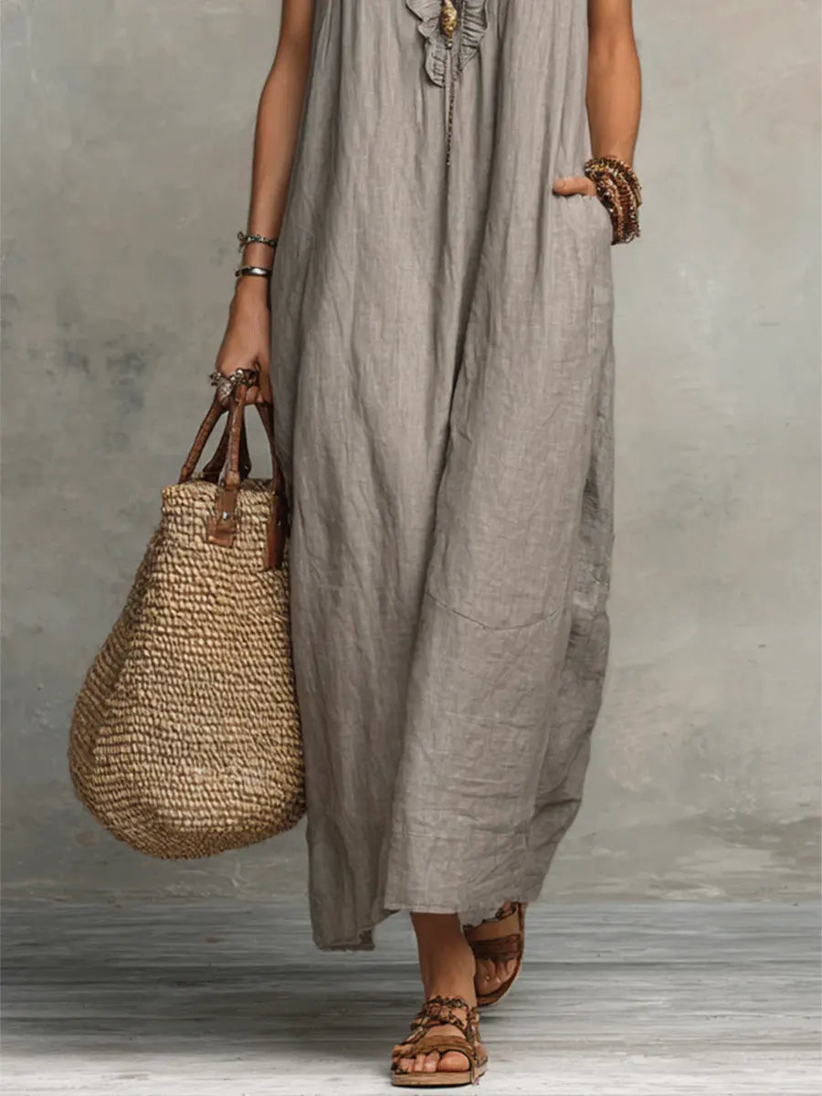 Stylish women's maxi dress with V-neckline, ruffles, flutter sleeves, and pockets. Perfect for summer and vacation.