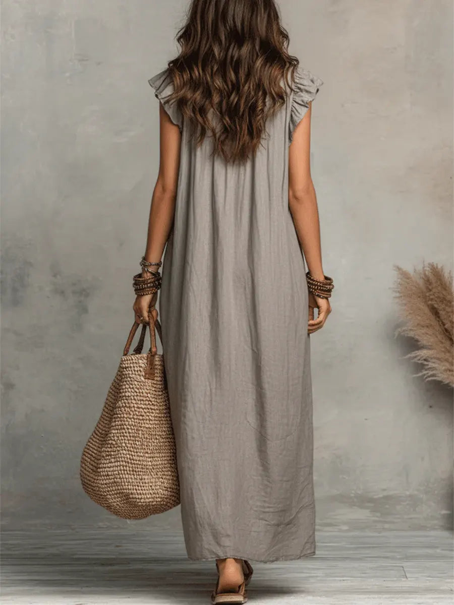Elegant women's V-neck ruffle maxi dress with flutter sleeves, offering comfort and style. Ideal for resort or casual.