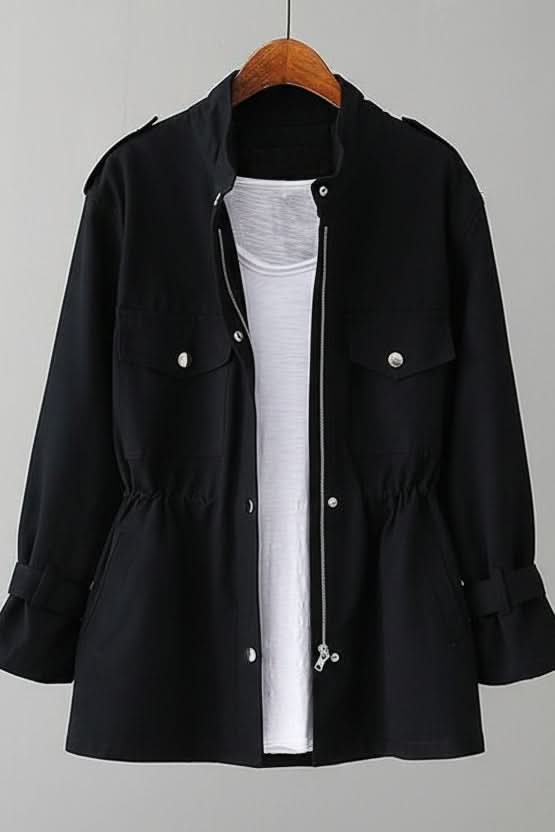 Durable women's modern utility jacket, rugged fabric, and a fashionable open back detail for chic styling.