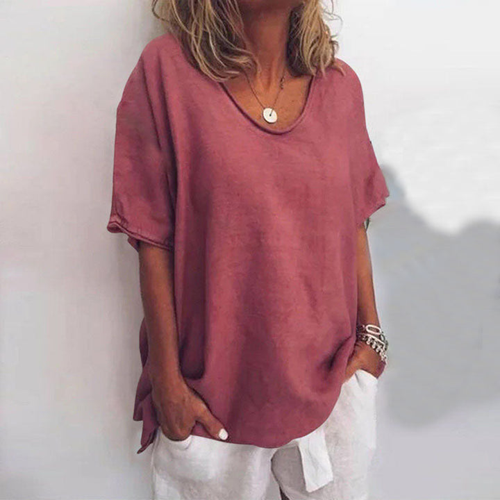 Soft fabric women's short sleeve blouse with a flattering scoop neck and relaxed loose fit for comfort.