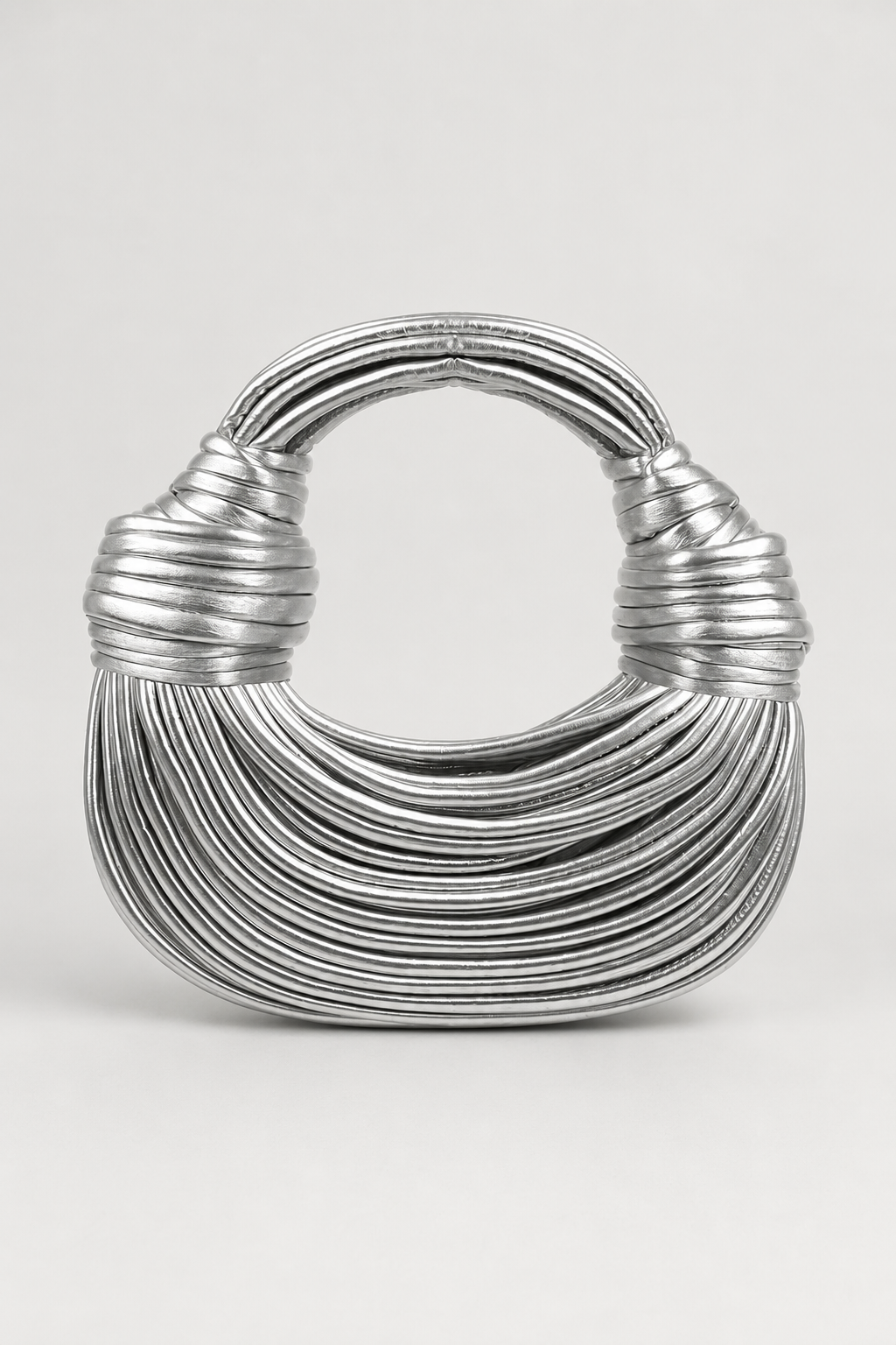 Chic women's crescent handbag, featuring a distinctive sculptural knot handle. Versatile everyday fashion bag.
