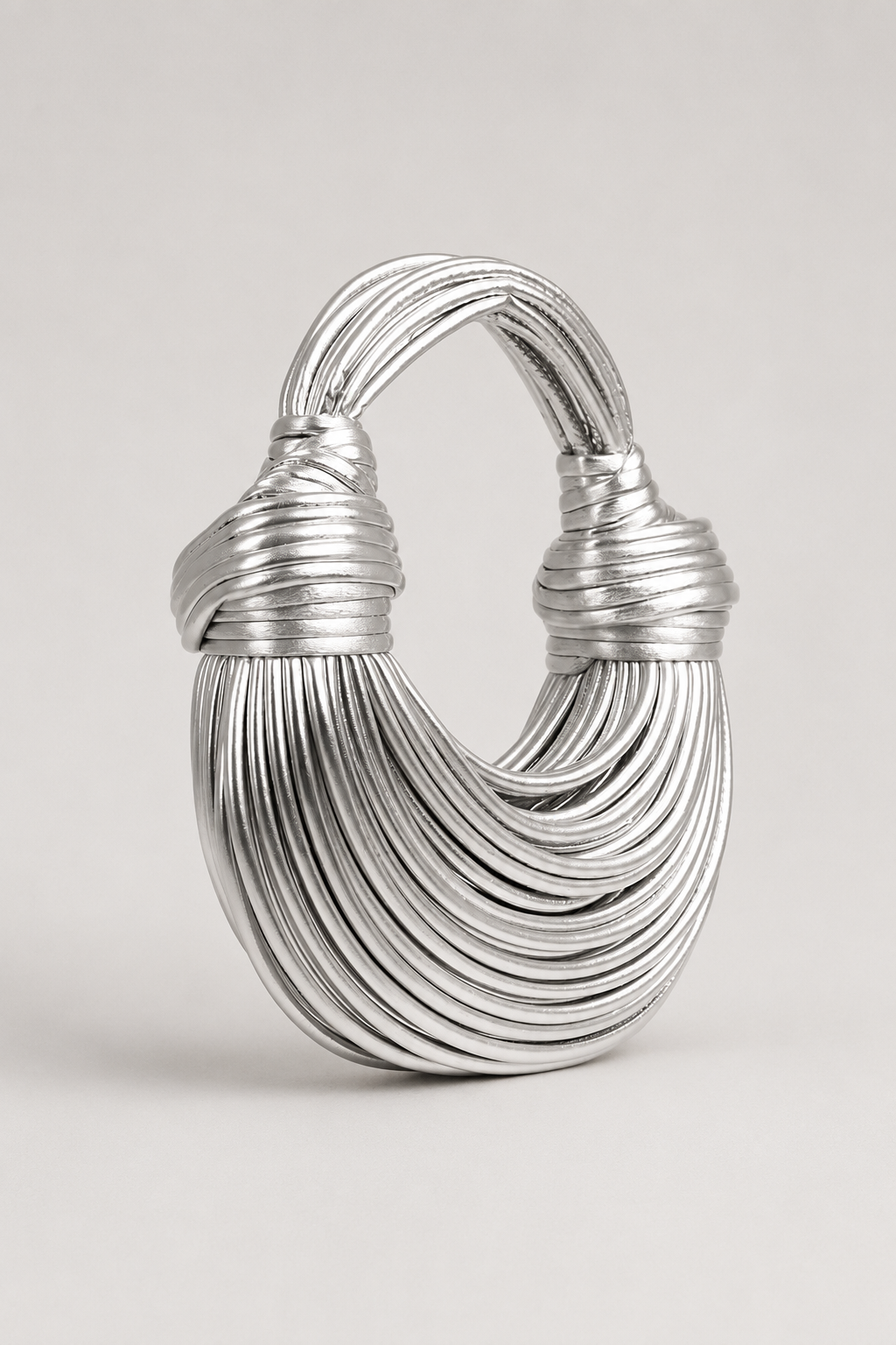 Fashionable women's crescent bag with a sculptural loop handle, perfect for everyday elegance. Unique shoulder bag.