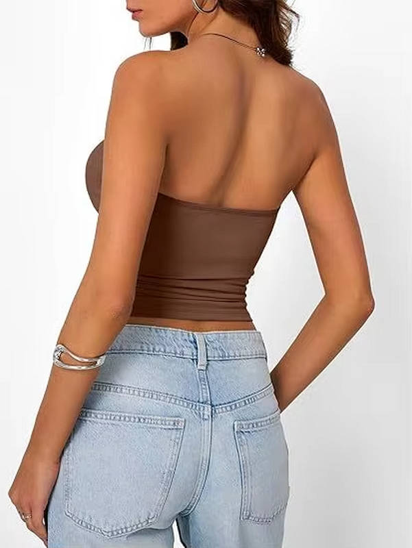 Folded women's seamless stretch bandeau crop top, compact for travel.