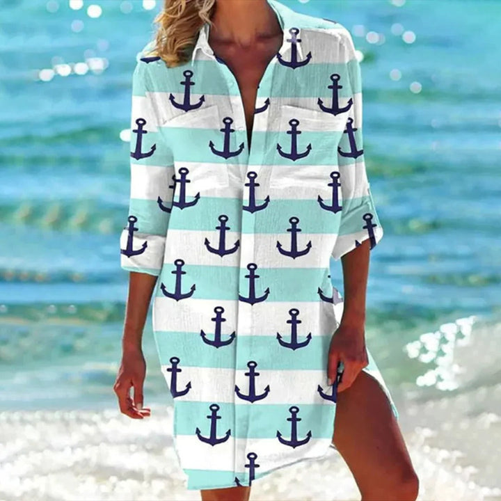 Breathable women's seashell print 3/4 sleeve beach cover-up shirt dress. Comfortable resort wear for warm weather.