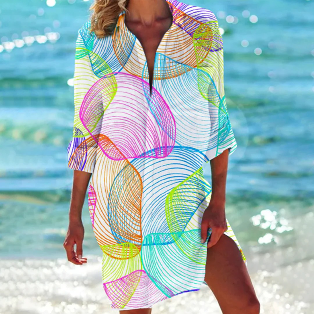Versatile women's seashell print summer dress. 3/4 sleeve shirt dress style, ideal as a beach cover-up.