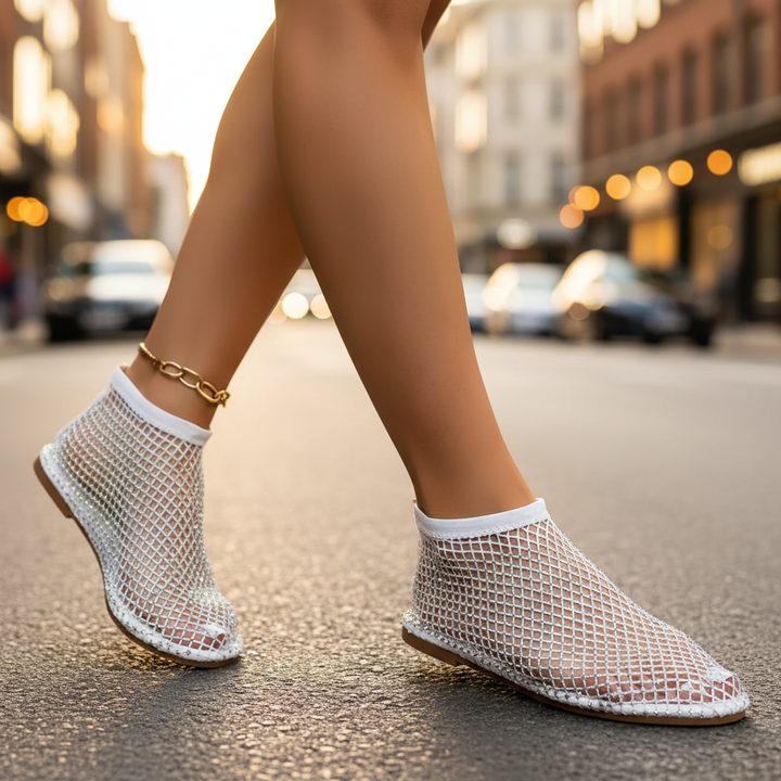 Women's sparkling flats with rhinestone embellishments & instep strap, offering a chic, comfortable slip-on fit.