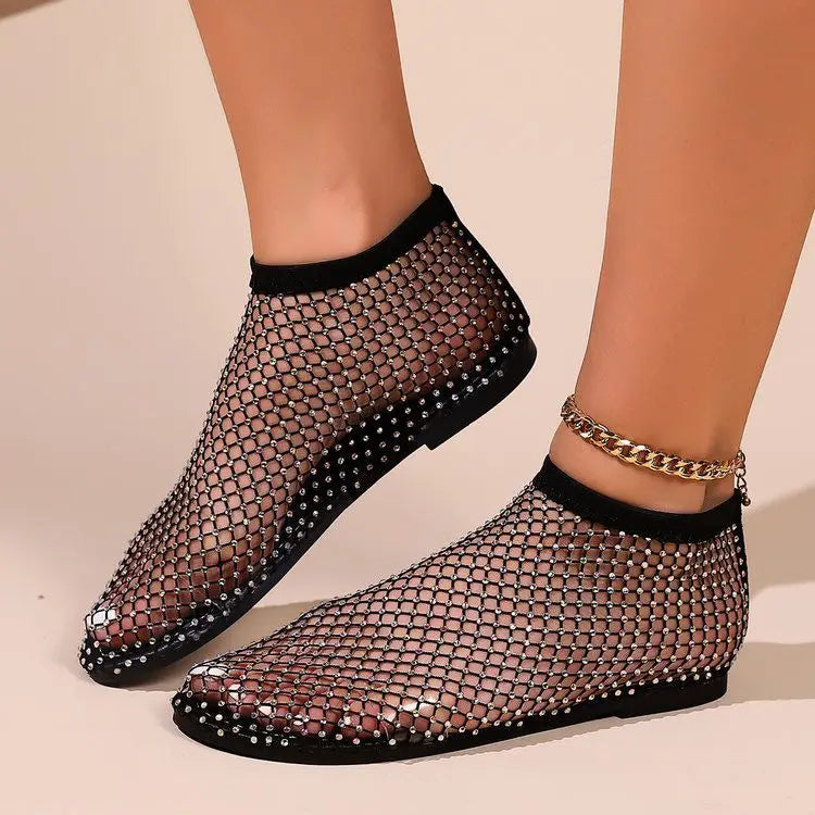 Side view of chic women's flat shoes with a comfortable instep strap & all-over sparkle. Ideal for dressy or casual.