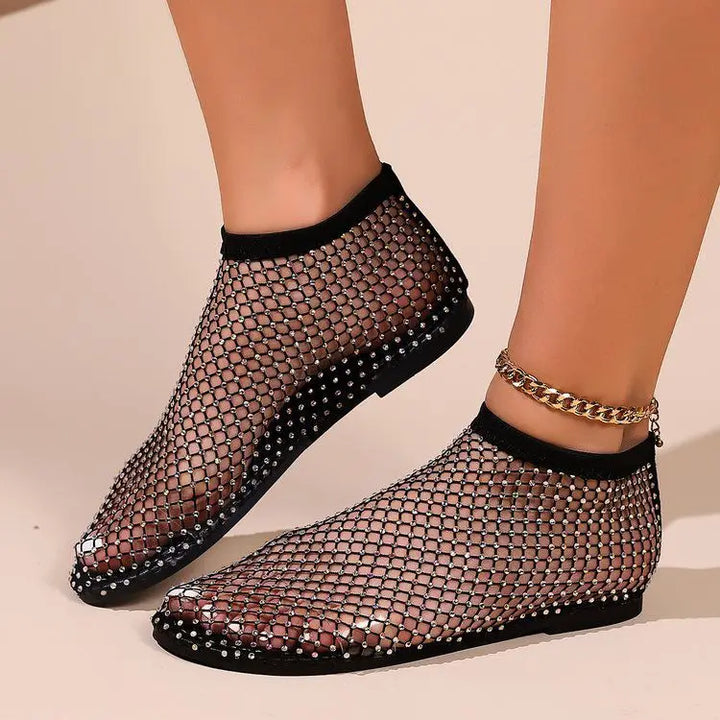 Side view of chic women's flat shoes with a comfortable instep strap & all-over sparkle. Ideal for dressy or casual.