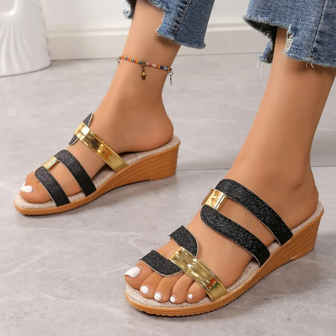 Pair of women's sparkling sandals with three delicate straps, ideal for summer fashion.