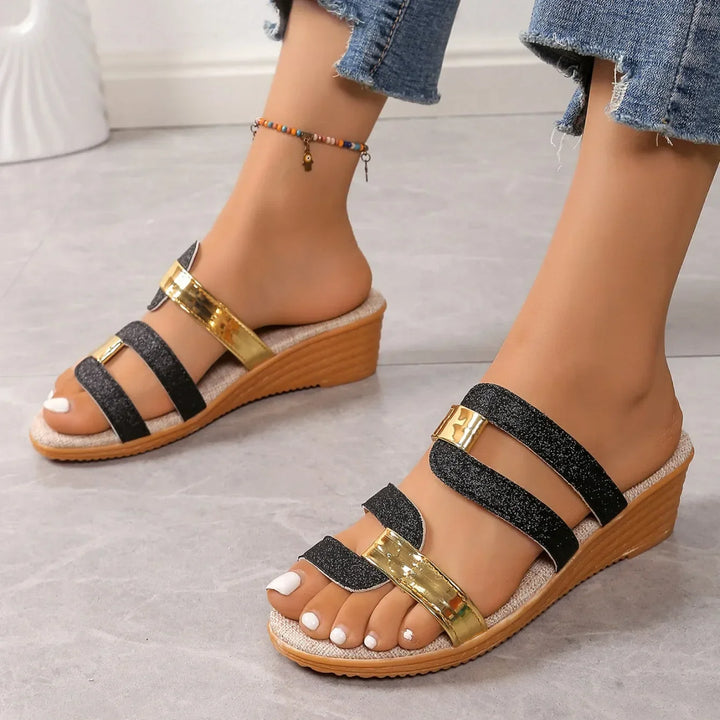 Pair of women's sparkling sandals with three delicate straps, ideal for summer fashion.