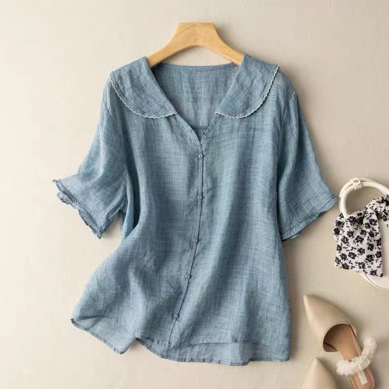 Elegant women's blouse featuring a unique scalloped collar, button-front, and relaxed fit. A chic summer top.