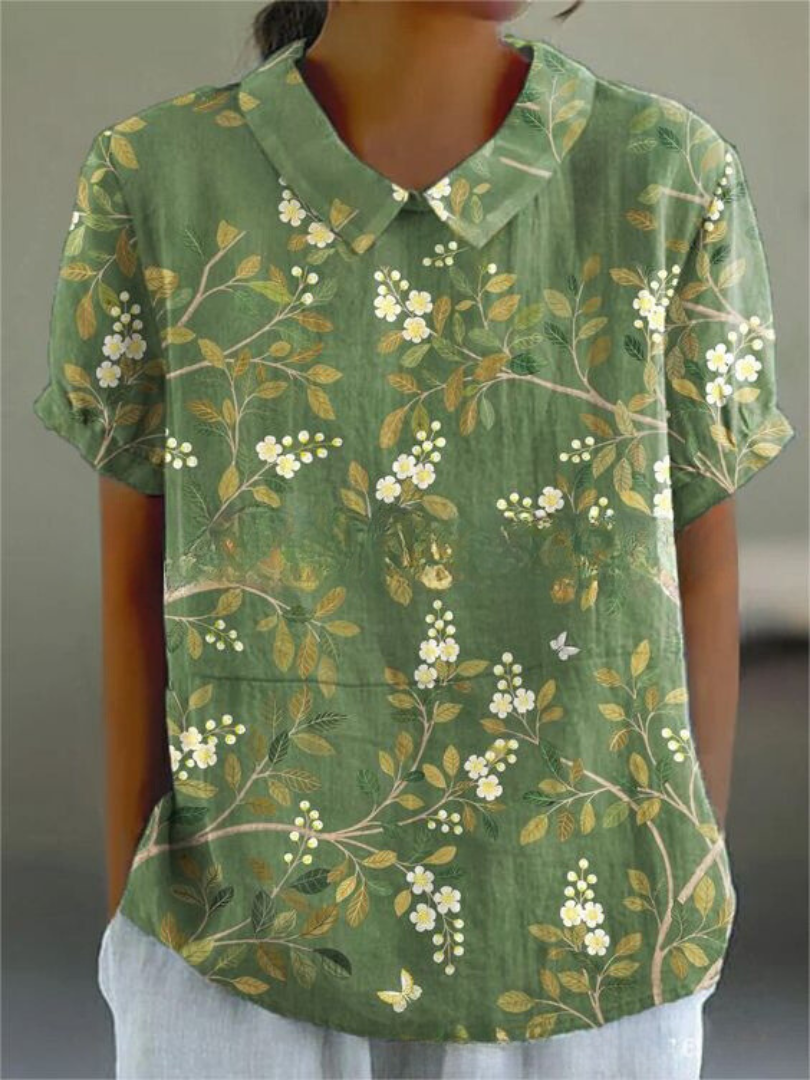 Beautiful women's floral print short sleeve blouse, a vibrant and elegant top for warm weather.