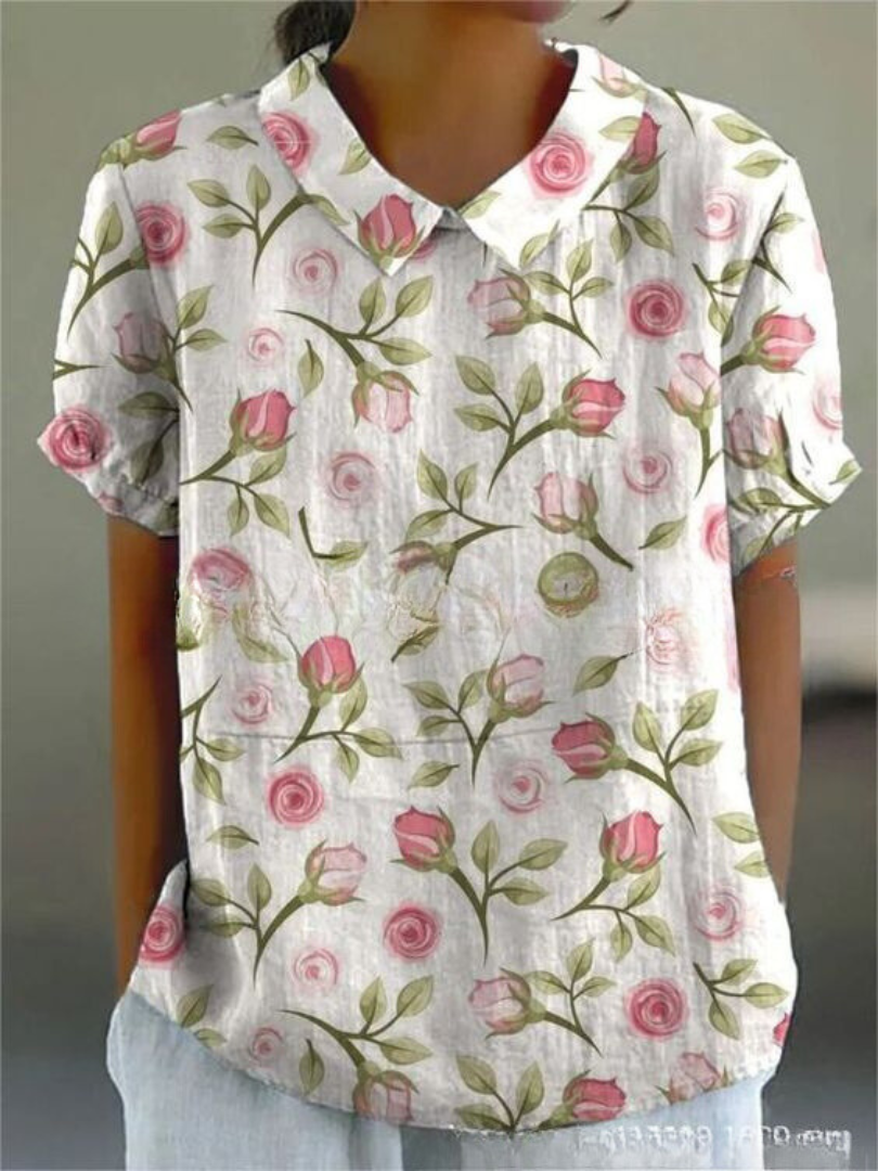 Stylish women's collared blouse with a colorful floral pattern, excellent for everyday spring-summer fashion.