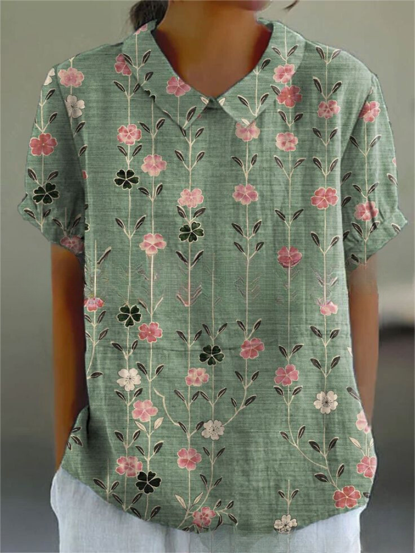 Chic women's short sleeve floral top, perfect as a versatile printed blouse for spring and summer outfits.
