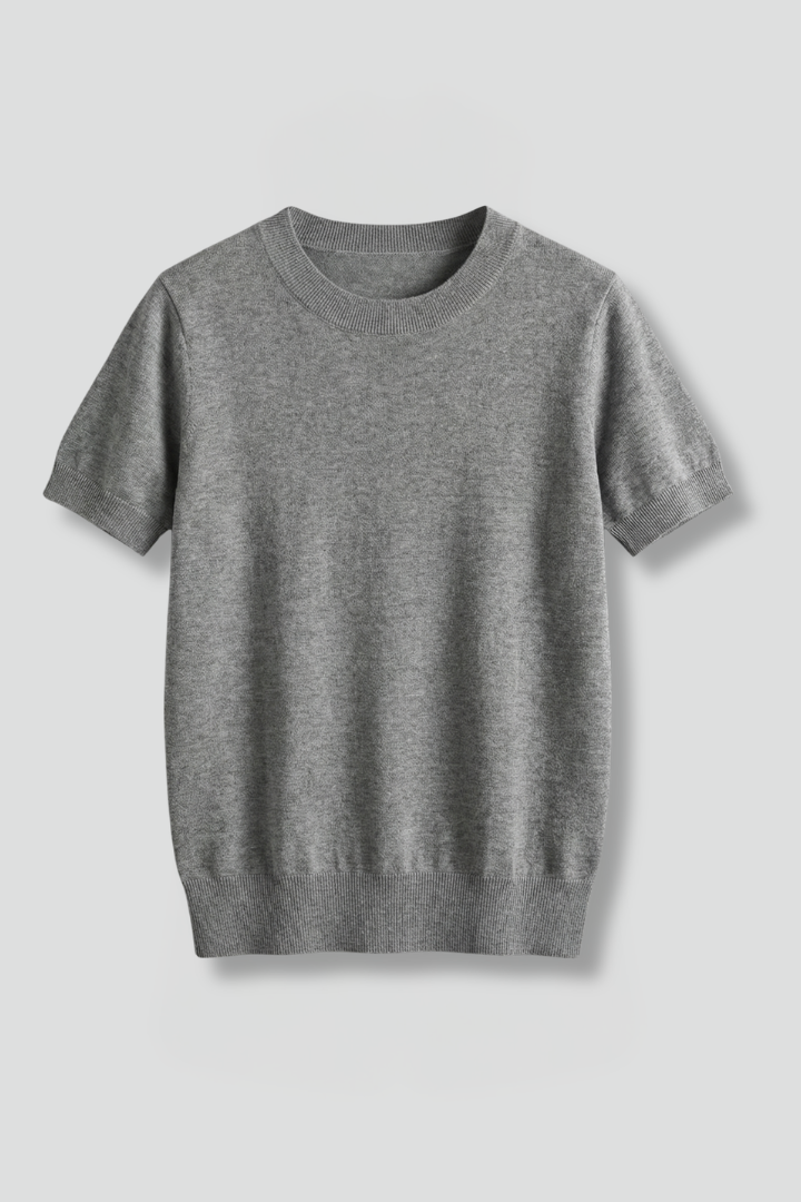 Women's short sleeve crew neck knit top with ribbed hem, perfect for comfortable casual wear.