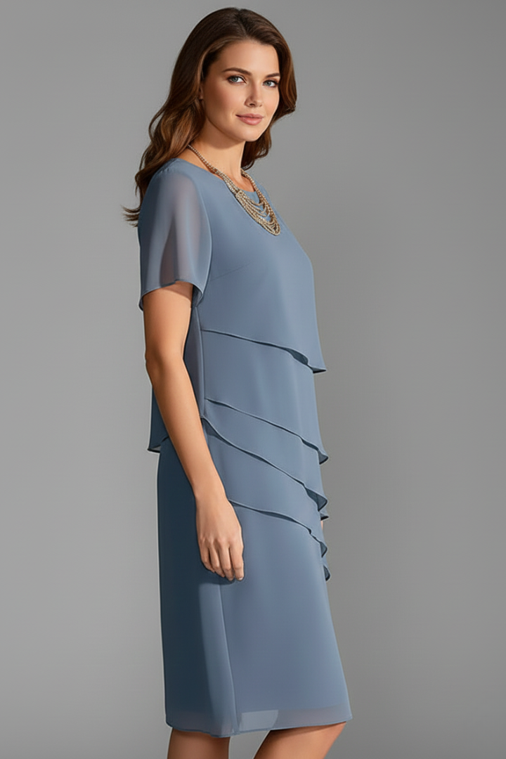 Comfortable women's short sleeve dress, featuring a stylish layered front and straight hem. Perfect for casual everyday.