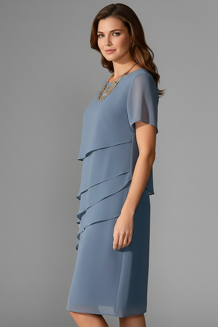 Chic women's short sleeve dress. Layered front, round neck, and straight knee-length hem for versatile casual fashion.