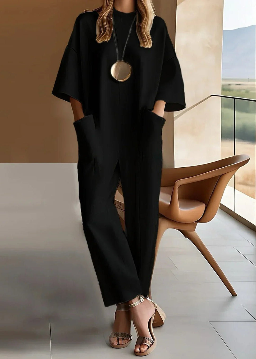 Flowing women's wide leg short sleeve jumpsuit; a versatile, relaxed one-piece ideal for casual outings & resort wear.