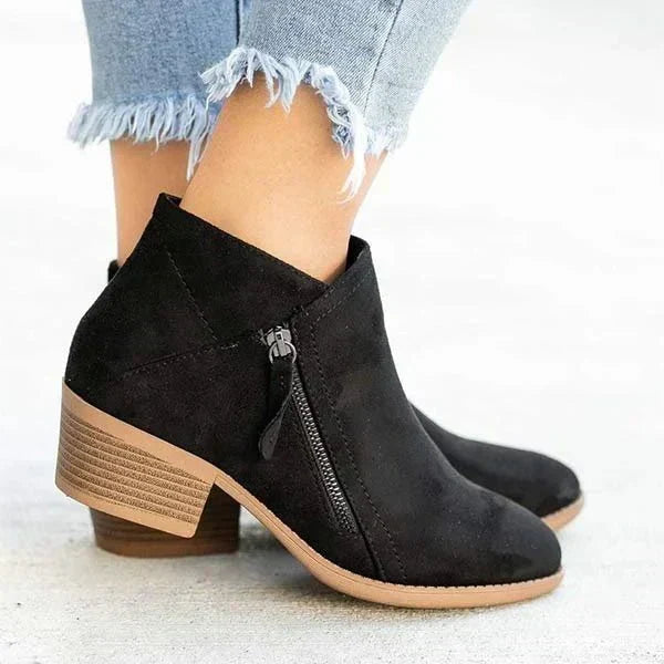 Blue casual ankle boots for women, featuring a sturdy block heel, side zip, and stylish pointed toe.