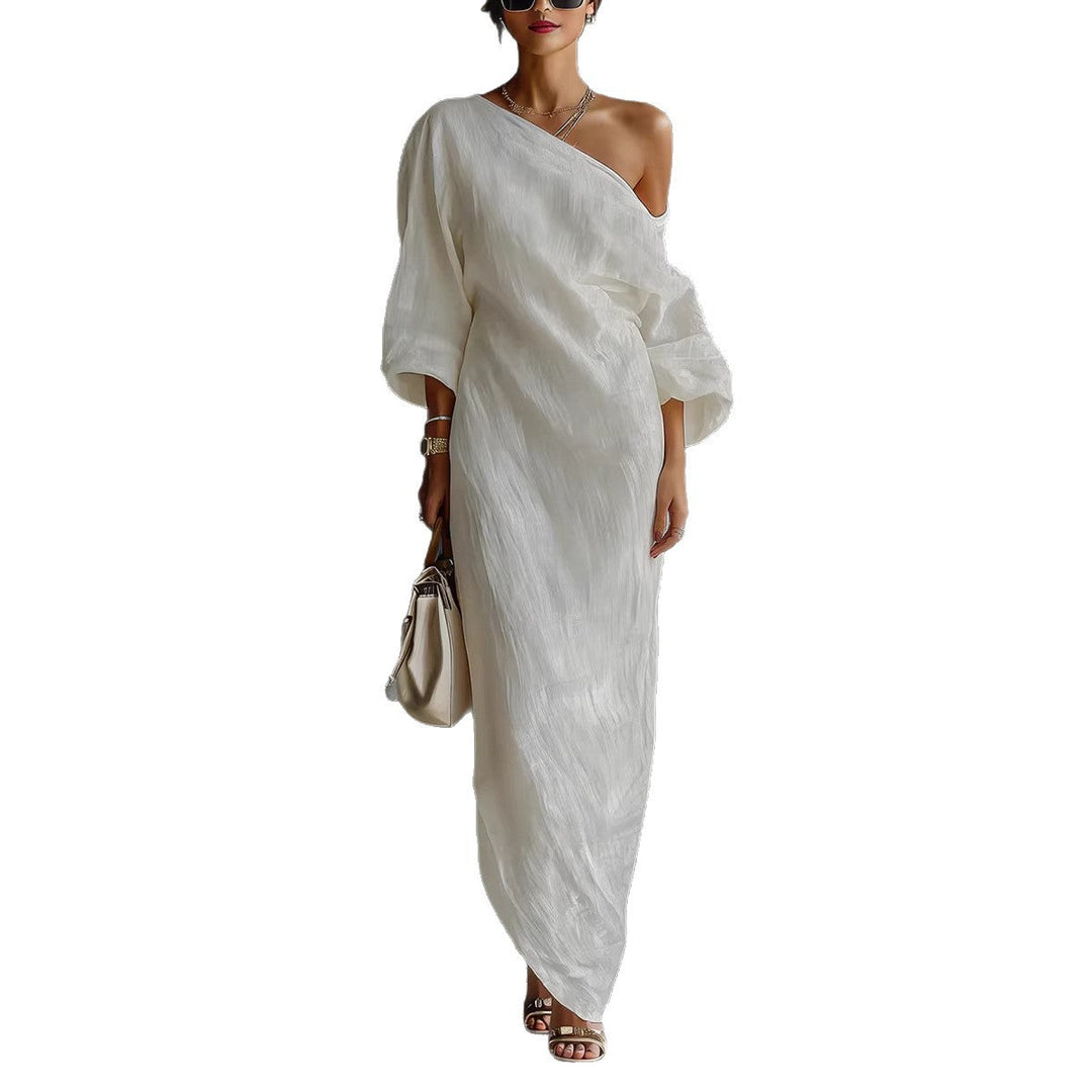 Boho chic women's loose fit maxi dress. Features a unique slanted neck and stylish lantern sleeves.