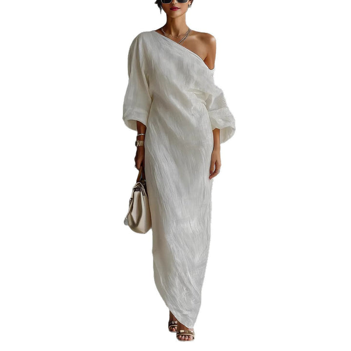 Boho chic women's loose fit maxi dress. Features a unique slanted neck and stylish lantern sleeves.