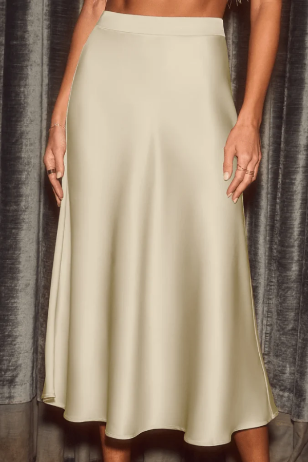 Elegant women's midi skirt with a graceful flow, enhancing any sophisticated wear ensemble.