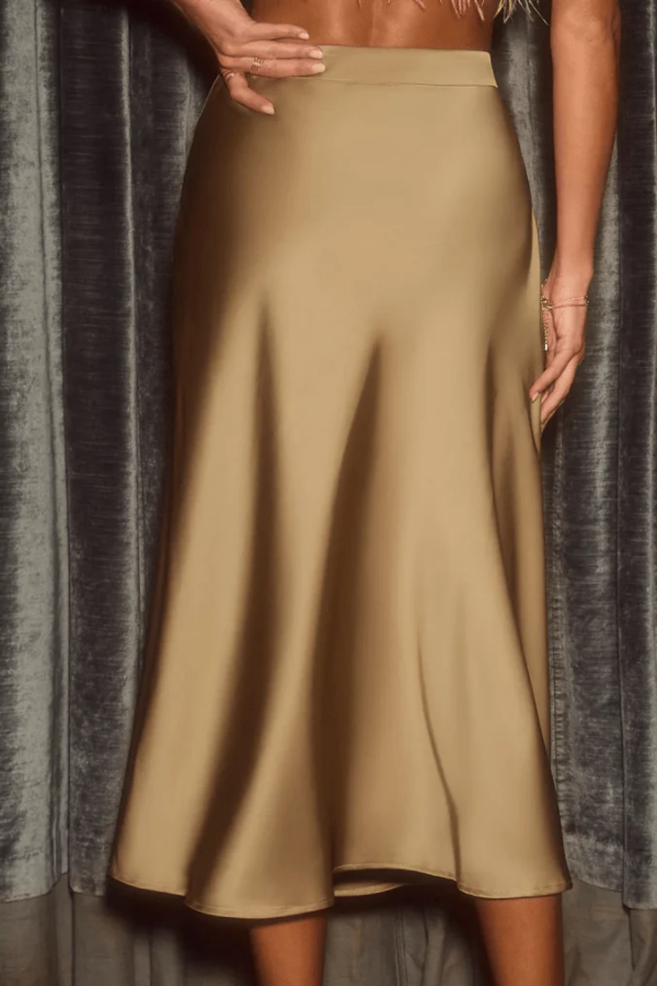 Versatile A-line midi skirt for women, featuring a sleek design for office, casual, or evening chic.