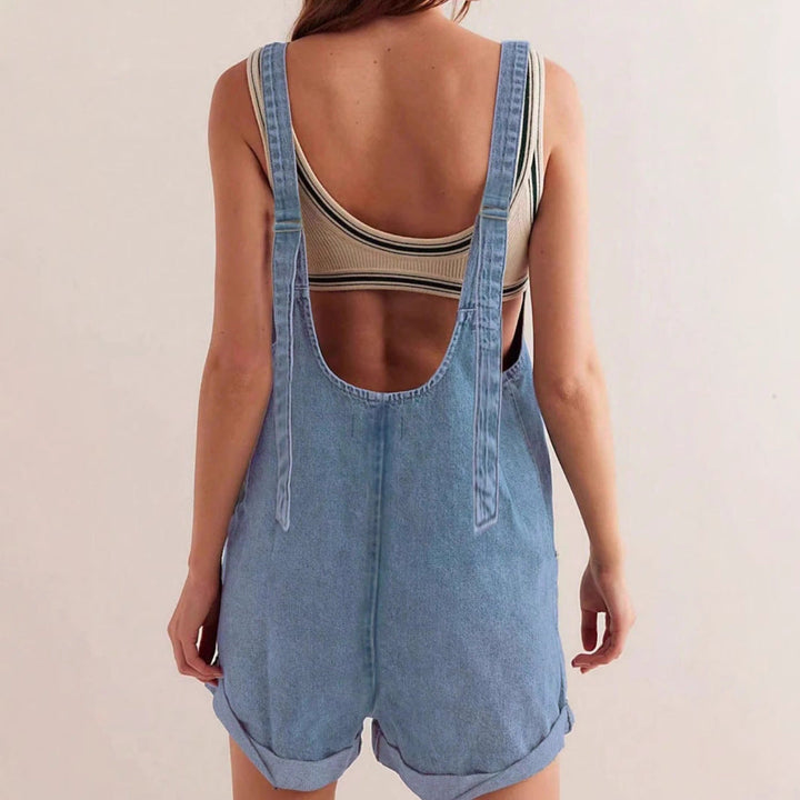 Casual women's denim jumpsuit, sleeveless, featuring convenient pockets for summer style.