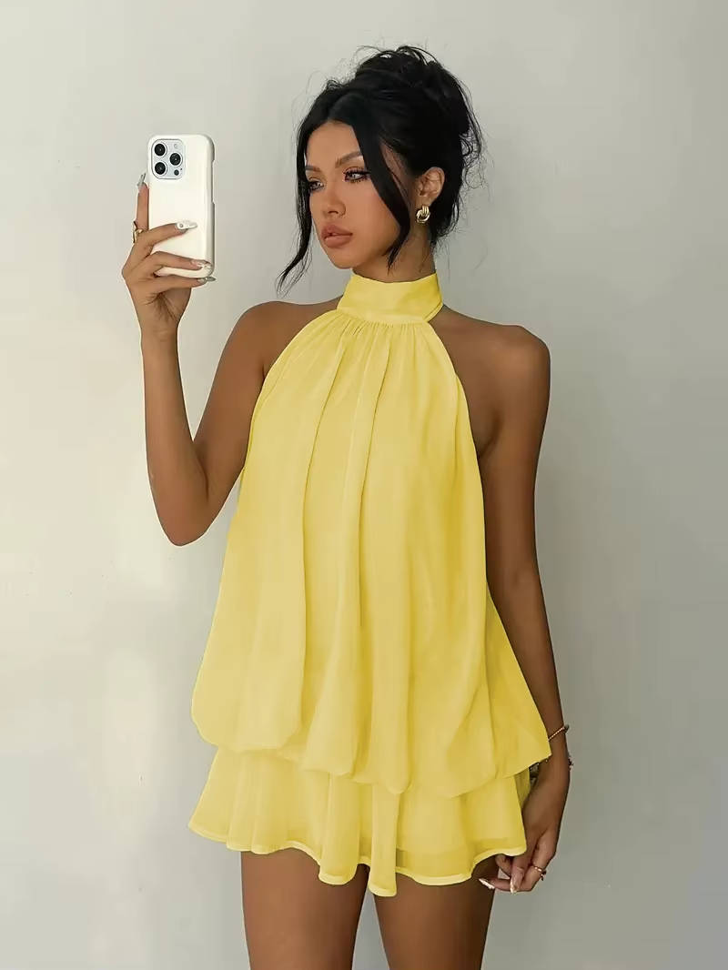 Women's sleeveless halter mini dress with ruffle hem & open back; a chic choice for parties & summer evenings.