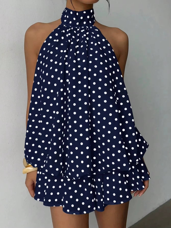 Versatile women's halter mini dress, sleeveless with a ruffle hem & open back; ideal for any party or event.