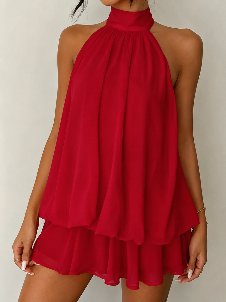 Perfect summer party dress: women's sleeveless halter mini with a playful ruffle hem and a gorgeous open back.