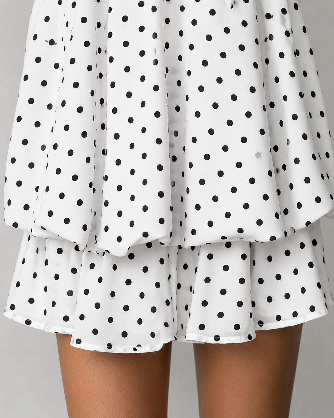 Stunning open back on a women's halter mini dress with a flowy ruffle hem; perfect elegant evening wear.