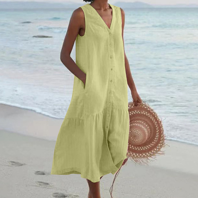 Versatile women's sleeveless summer midi dress. Features a chic V-neck, button-front, and comfortable tiered style.