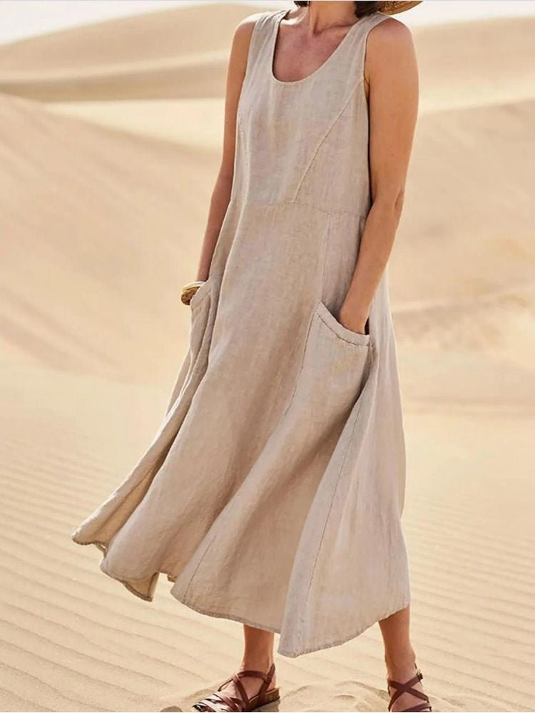 Women's sleeveless midi dress with scoop neck & pockets. Perfect for casual summer wear & comfort.