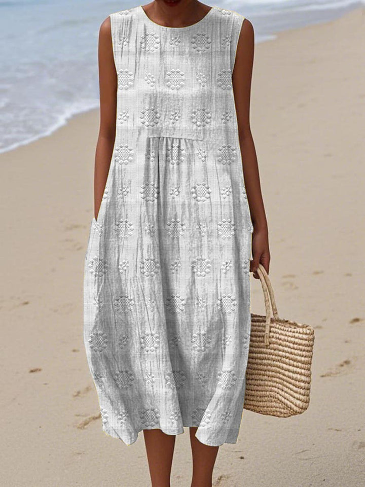 Comfortable sleeveless women's midi dress with convenient pockets, available in plus sizes.