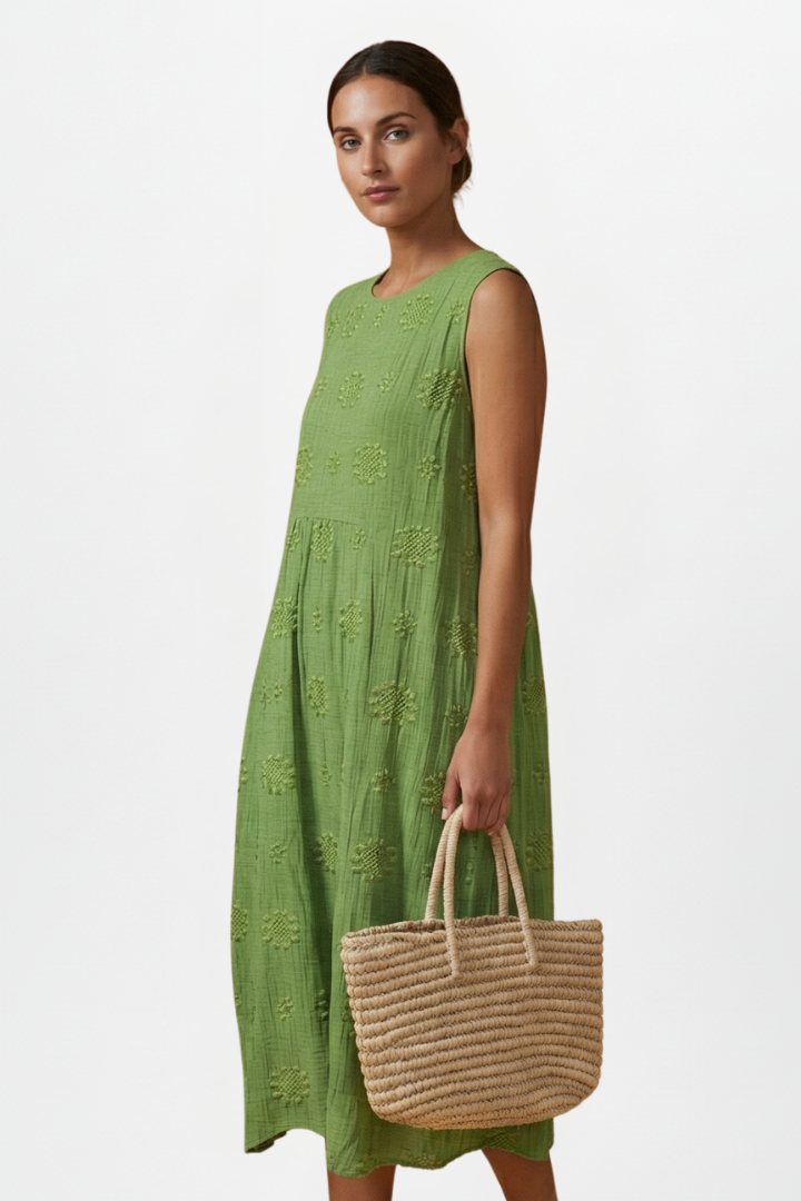 Women's apparel: sleeveless round neck midi dress with textured pattern, comfortable & stylish for spring.