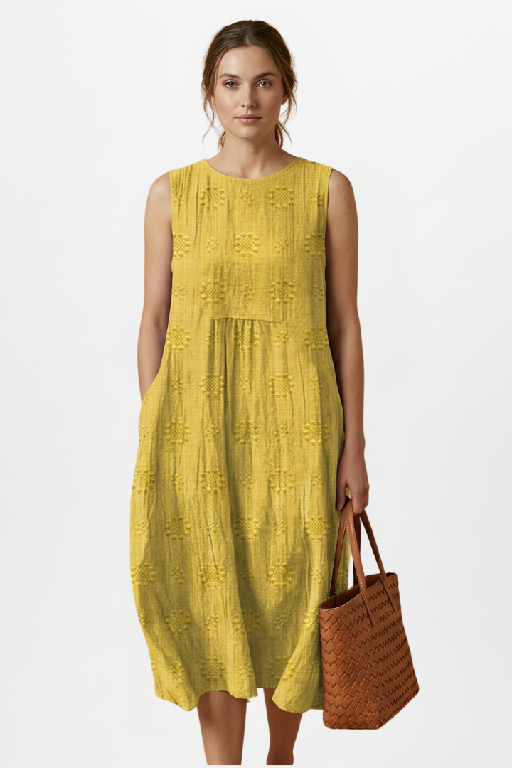 Lightweight women's summer midi dress, sleeveless, round neck, with a subtle textured pattern for comfort.