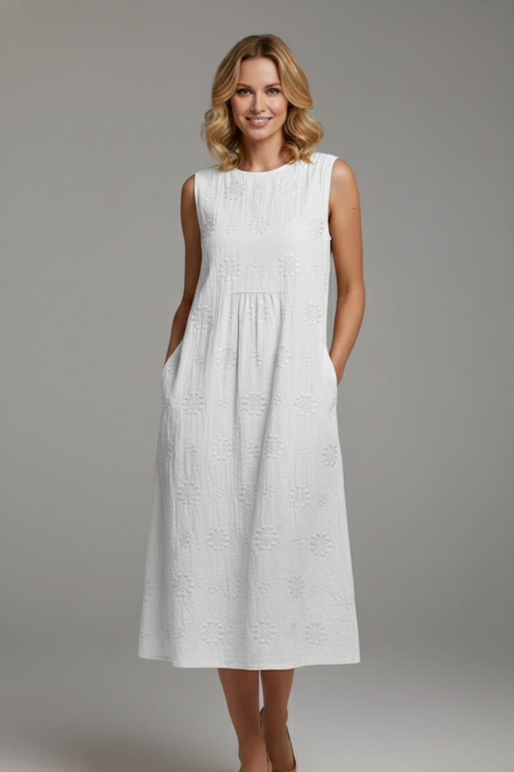 Women's textured pattern midi dress, sleeveless, round neck, a comfortable and stylish spring fashion choice.