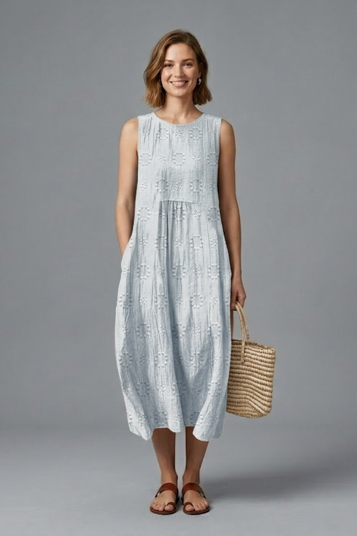 Sleeveless round neck midi dress for women, featuring a beautiful textured pattern, great for warm weather.