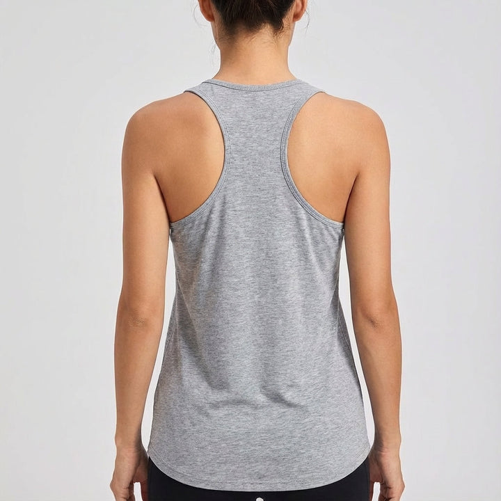 Sleeveless round neck sports top for women, made with elastic fabric for active comfort & training. Gym essential.
