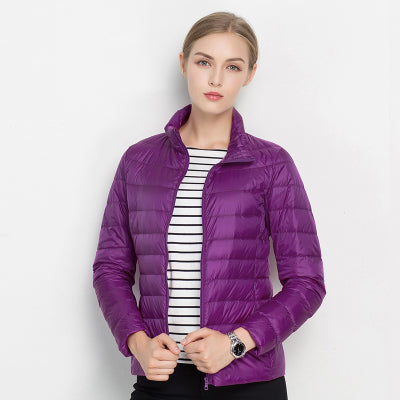 Insulated women's puffer winter coat, slim cut, with a model wearing it, showcasing elegance and comfort.