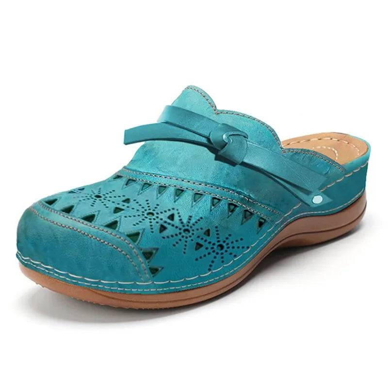 Everyday women's clogs: slip-on, bow accent, cutout design. Chic & comfortable summer sandals for any outfit.