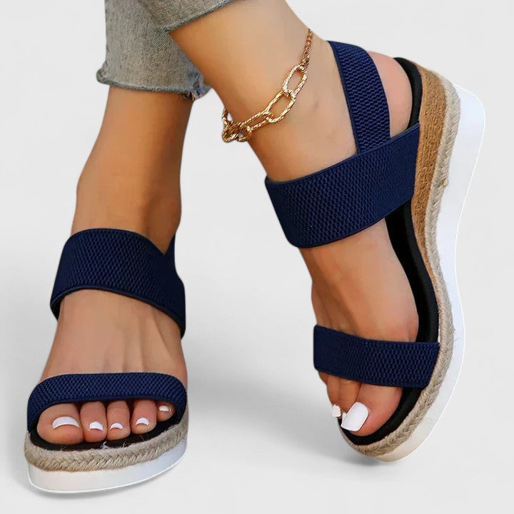 Elegant women's slip-on espadrille wedge sandals, open toe, elastic straps, comfortable jute sole for summer.
