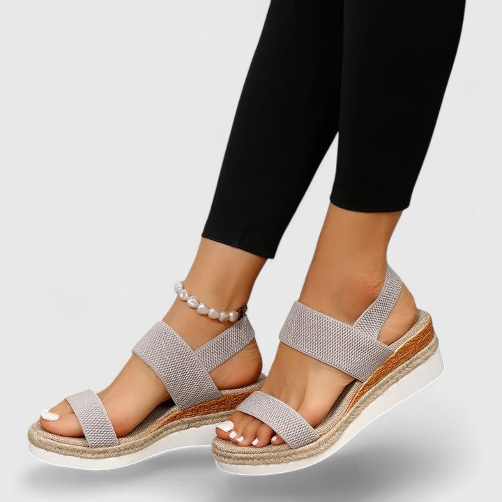 Effortless women's espadrille wedge sandals with elastic straps, open toe, & comfy jute sole. Summer slip-ons.