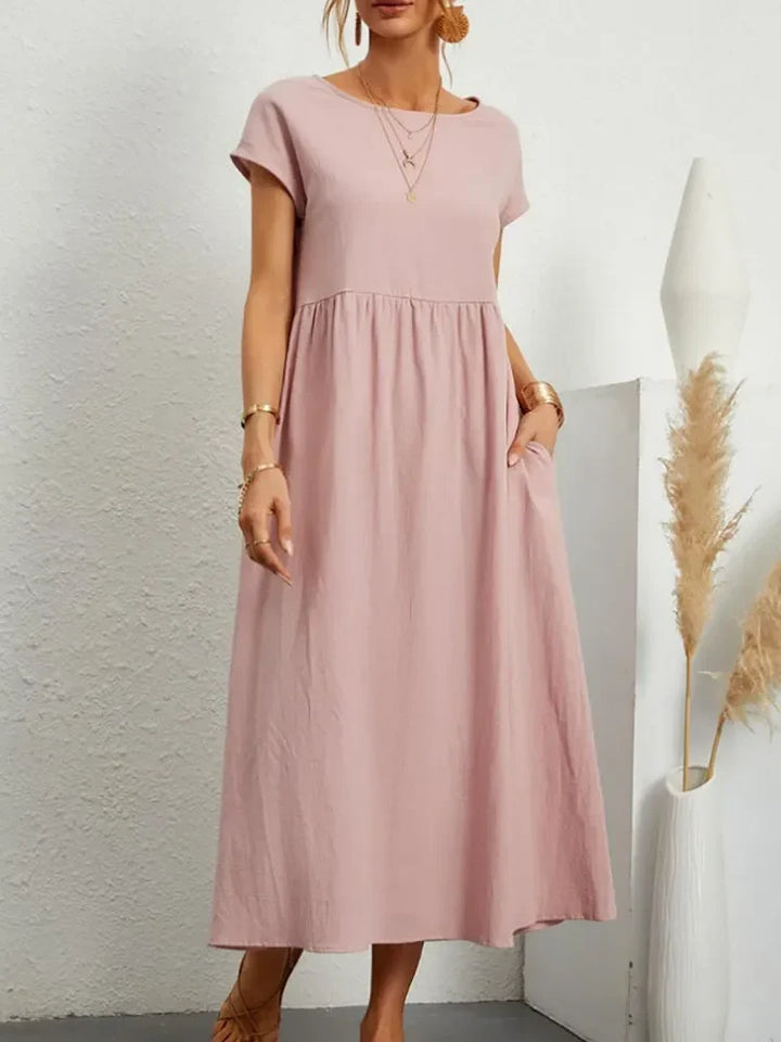 Relaxed fit women's smock waist maxi dress with short sleeves, A-line silhouette for ultimate comfort.