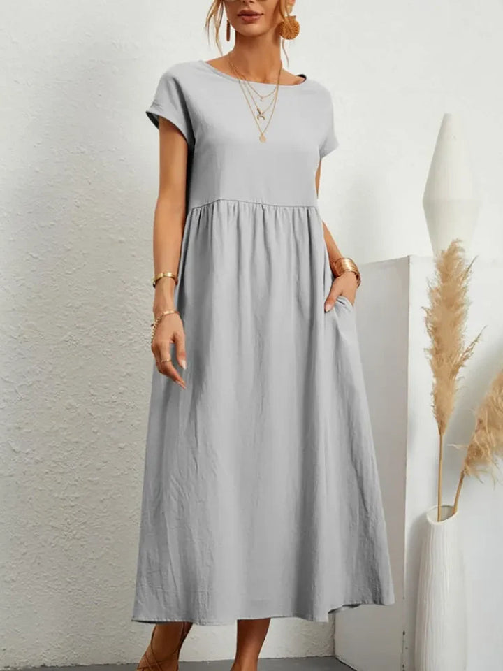 Versatile women's short sleeve smock waist maxi dress, perfect for casual spring and summer everyday wear.