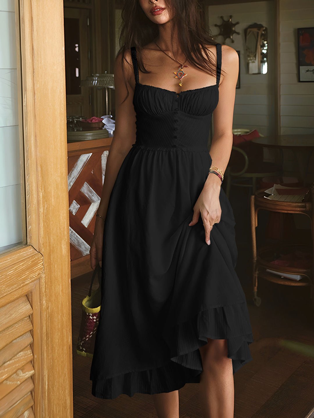 Stylish white sleeveless smocked midi dress with delicate spaghetti straps & ruffle hem for a chic summer look.
