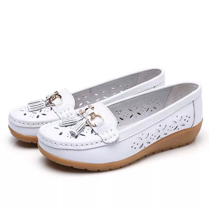 Women's comfortable slip-on moccasin sandals with breathable design & arch support.