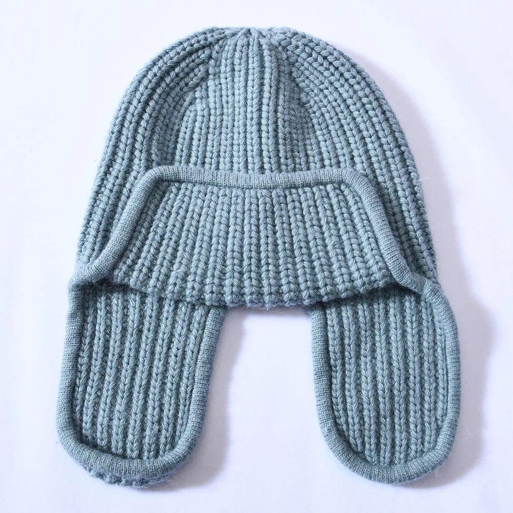 Cashmere blend knit beanie for women, showcasing its stretch and comfortable fit.